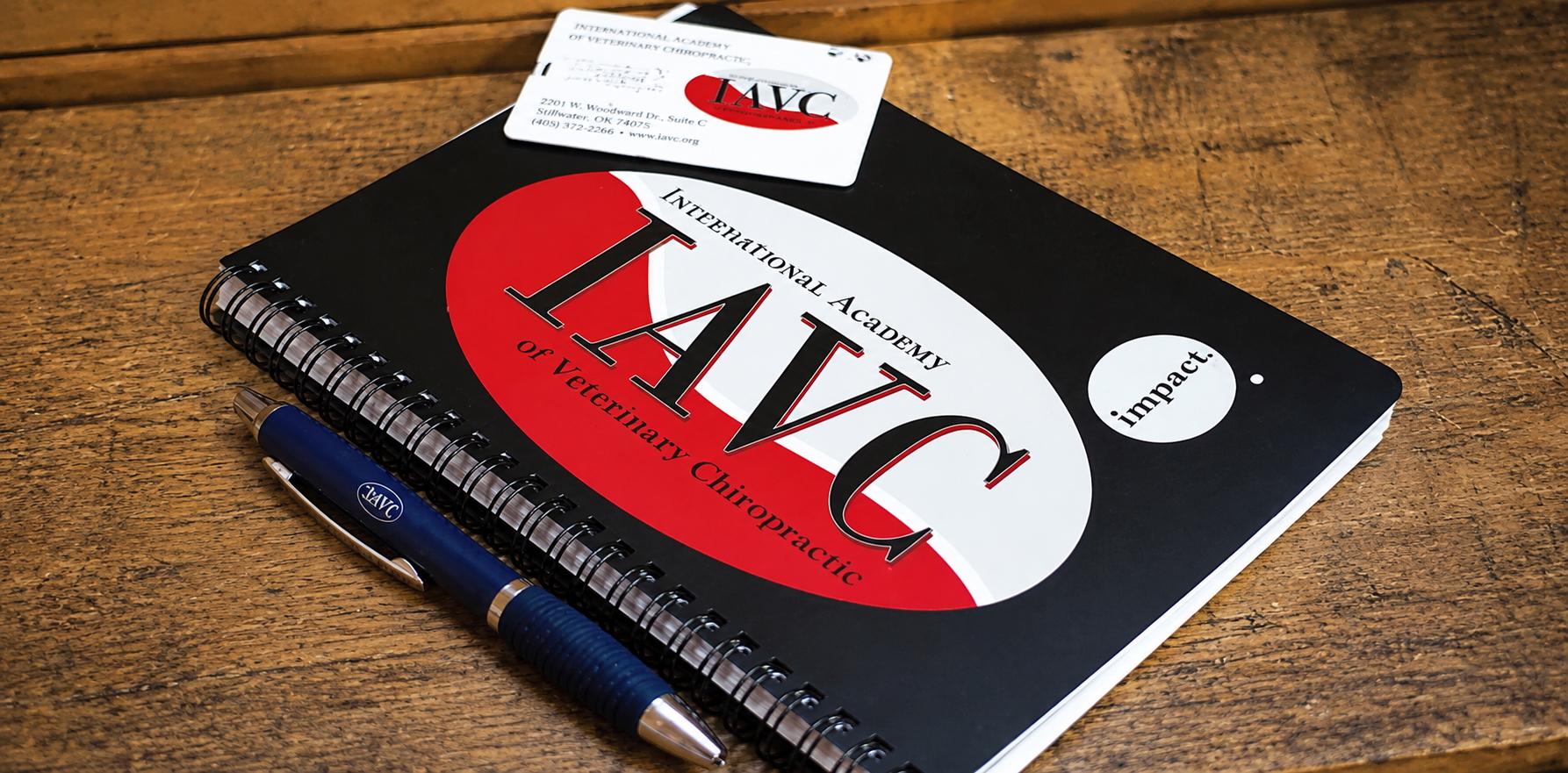 IAVC course notebook, pen and academy card
