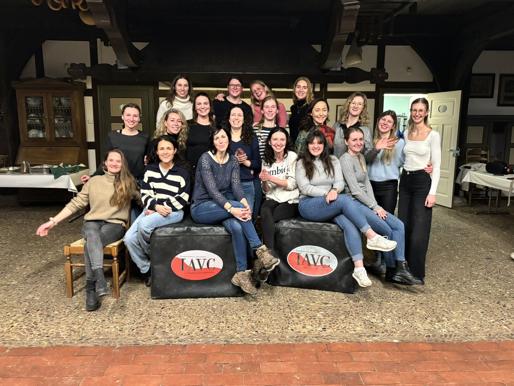 Group of Equine Essentials participants gathered with IAVC training equipment.