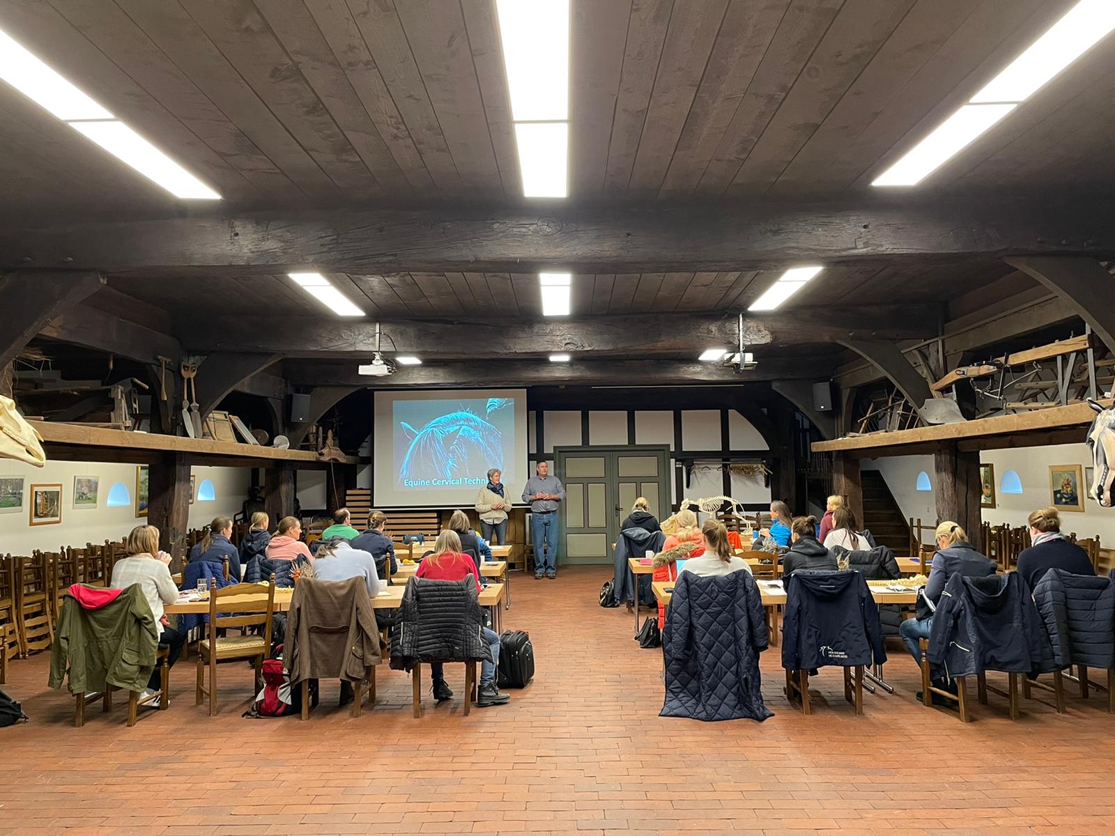 IAVC international faculty teaching veterinary chiropractic students in a classroom